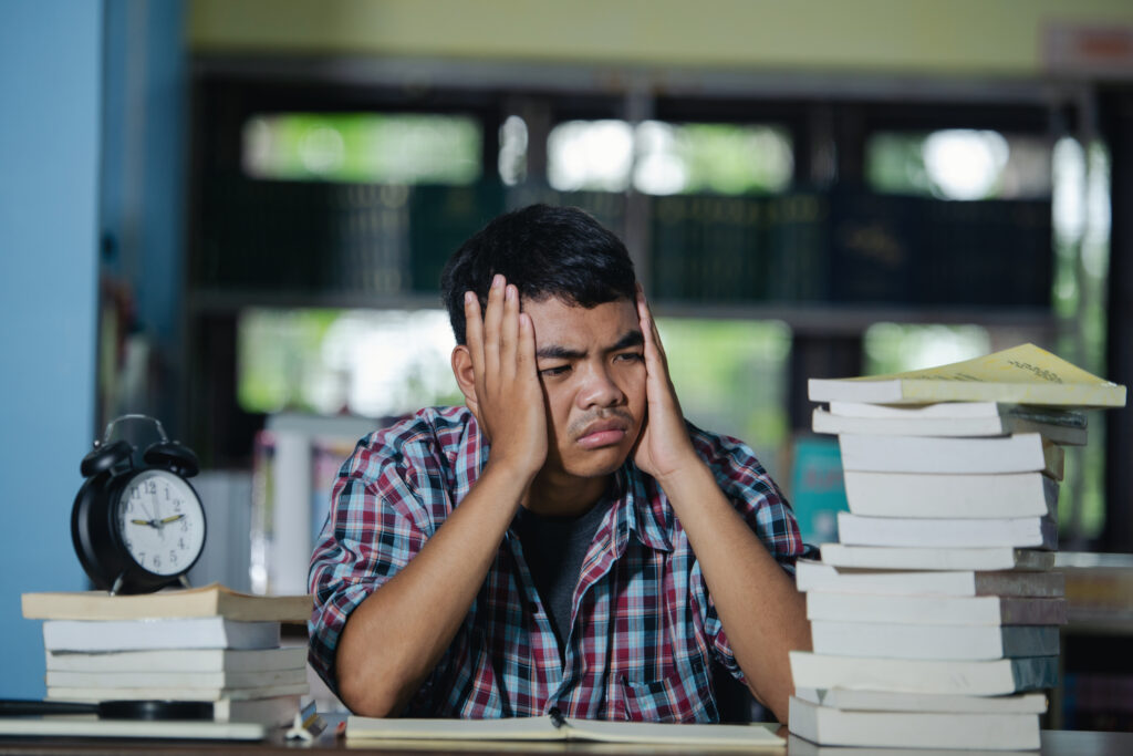 Books clock student tired thinking tension library time